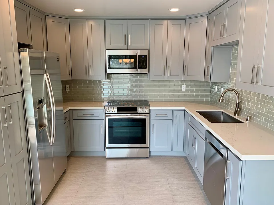 Kitchen, everything is brand new, glass tile backsplash, cabinets, stainless steel sink, and high-end stainless steel Samsung appliances