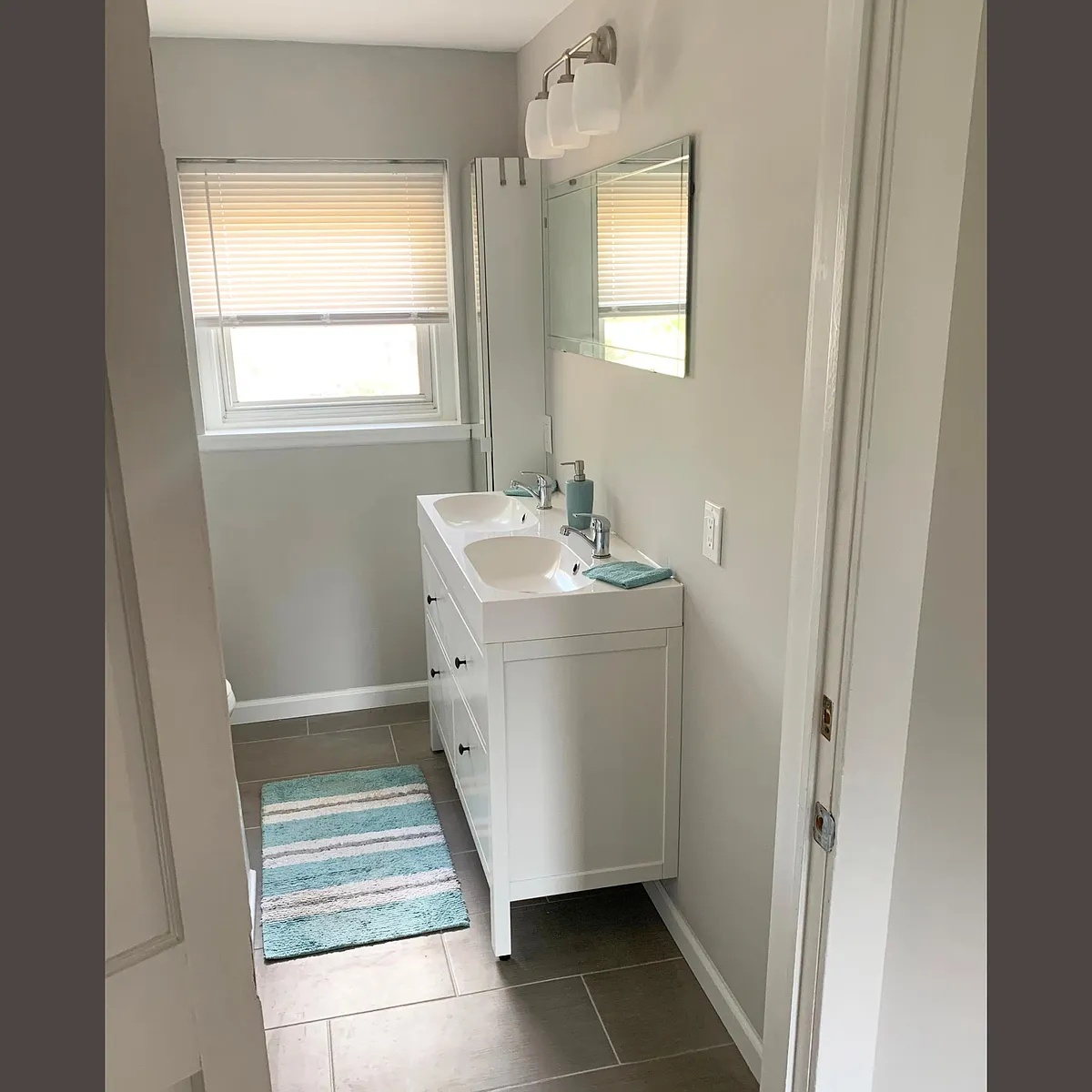 Lots of storage in tall cabinet and sink cabinet. - 173 Russo Dr #A