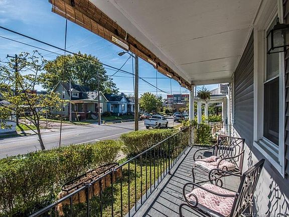 View down the block shows the Breakwater Apartments in the distance. So close to Downtown! (Porch has been COMPLETELY updated since this photo with new railings and surface.)