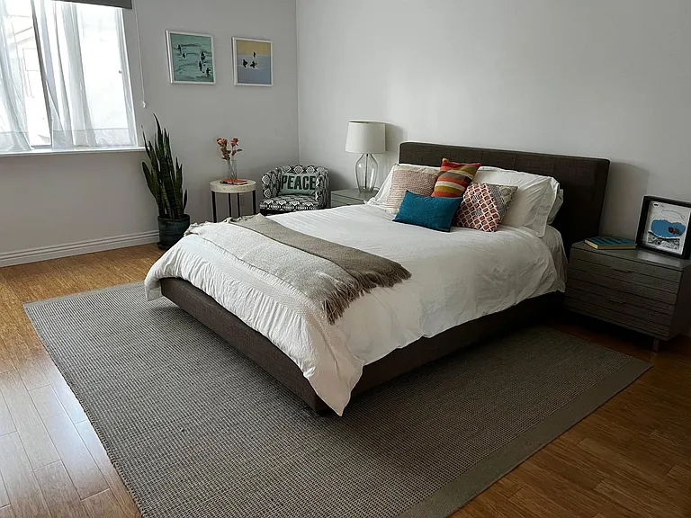 Large primary room. Bed has been updated to be king size. There is plenty of room for a desk if an additional work from home space is needed.