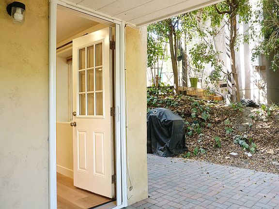front door with view of patio