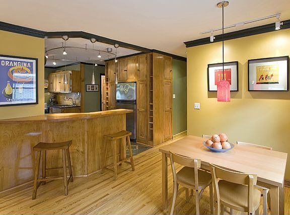 Breakfast area adjacent to kitchen and large living room.
