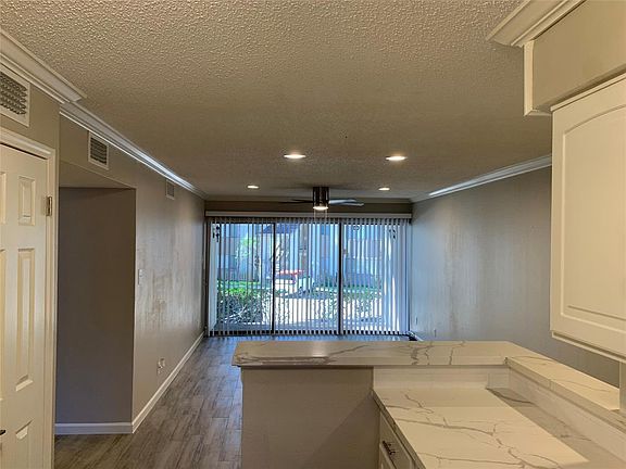 This unit has an open floor plan and is flooded with natural light.