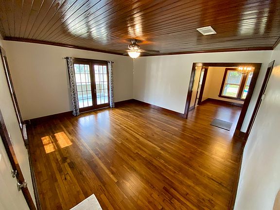 Front door to the left, French doors open to Florida room. Straight ahead is the dining room with original chandelier