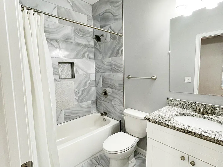 Master bedroom with en suite bathroom and walk-in closet