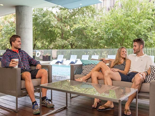 Gather with friends at our pool lounge.
