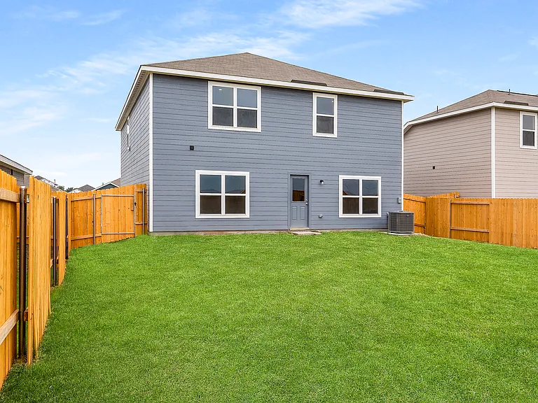 The back yard is fully fenced.