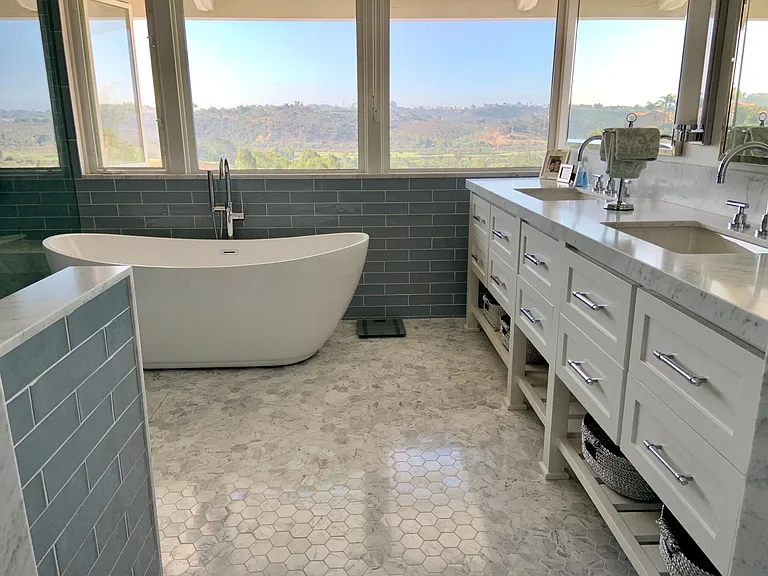 Master bathroom with custom counter double sinks and tub