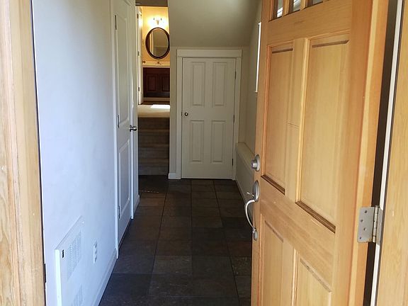 Front Door Entry leads to lower level bedroom and bathroom