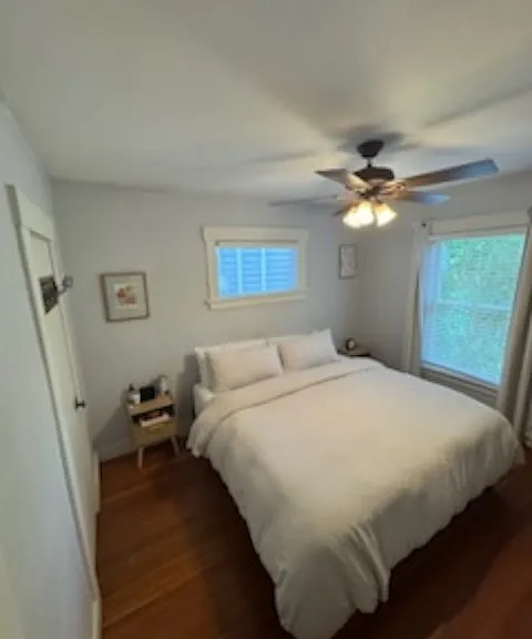 Angle to see 2 night stand tables and King size bed