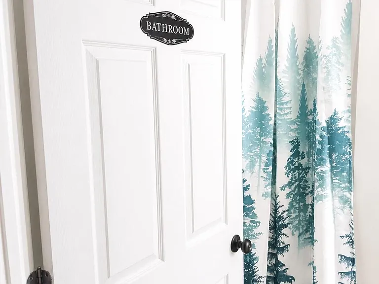 Full bathroom with a shower/tub combo and curtain, offering a convenient setup for daily use.