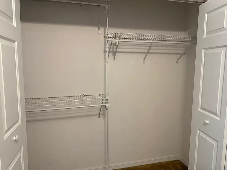 One of two closets primary bedroom