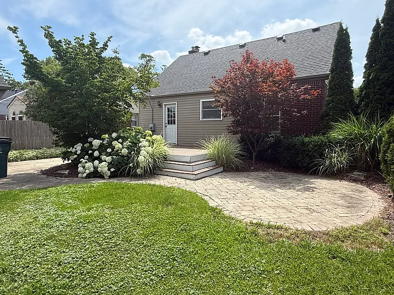 Patio area ready for a fire pit and chairs!