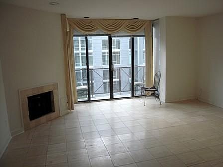 Living room and balcony facing the Ritz Carlton.