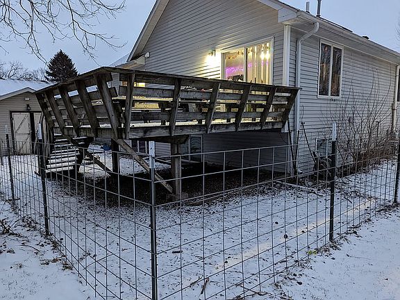 Fenced yard with deck, shed