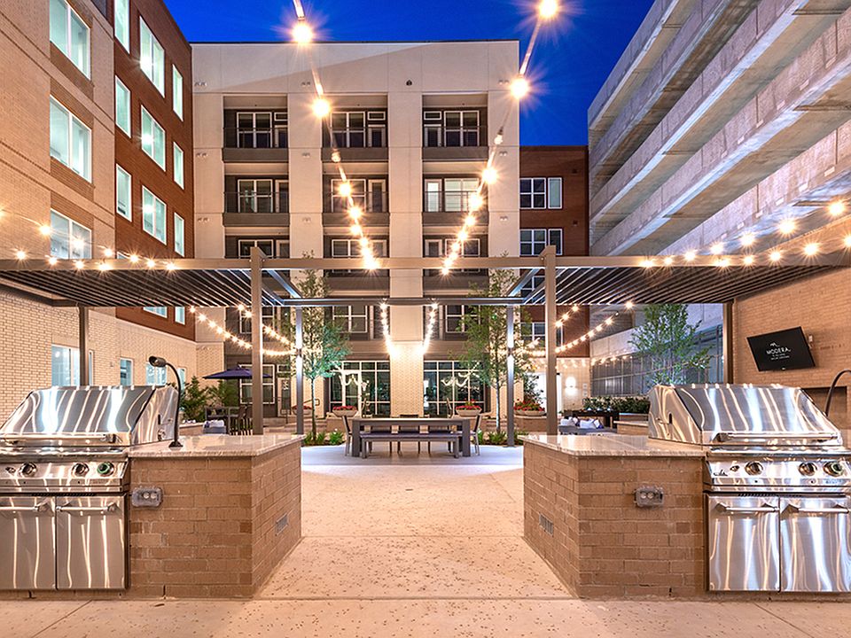 Enjoy a night with friends grilling under the twinkling lights at Modera Dallas Midtown