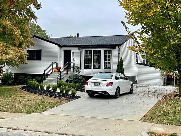 Long driveway and ample street parking with private entrance around back of house