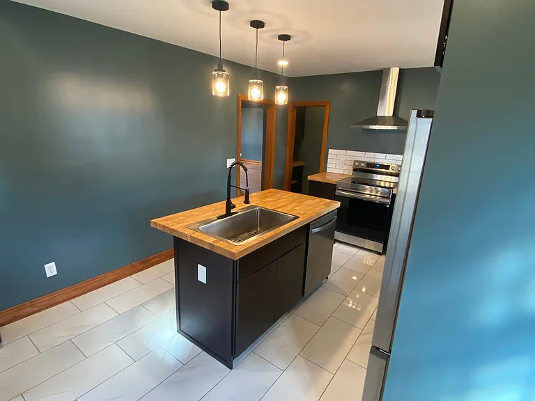 Custom island with dishwasher.