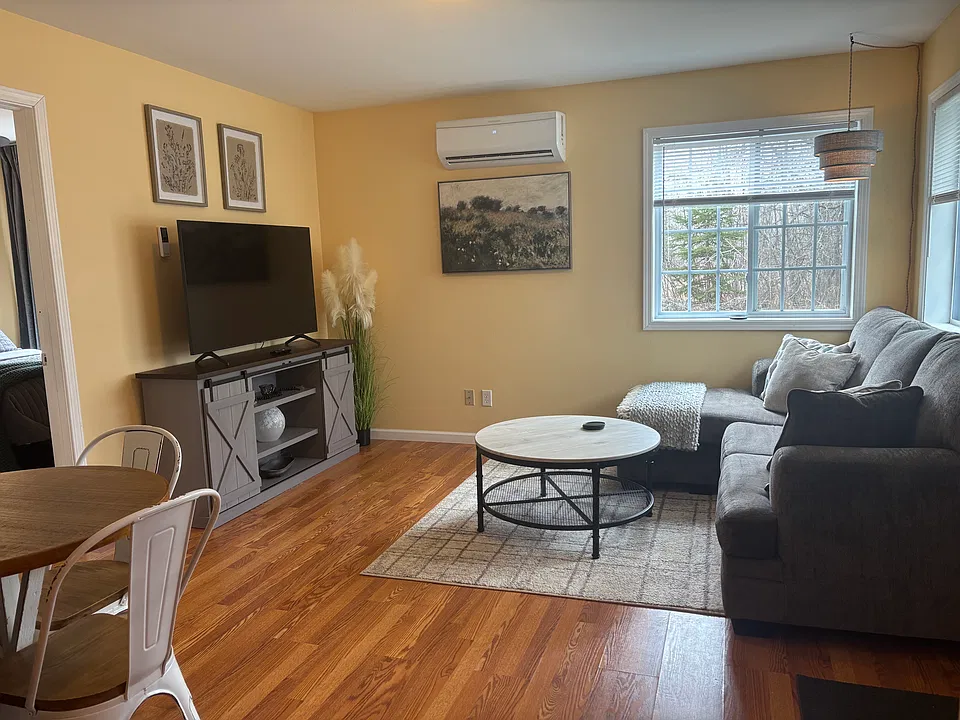 Sample furnished unit shown to illustrate layout and room size. Available unit is unfurnished.