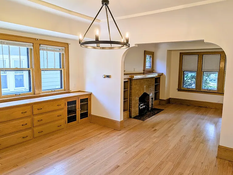 Refinished oak hardwood floors in the dining and living room. Built-in, solid wood cabinet. Plenty of windows