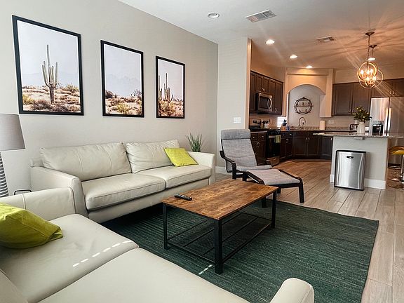 The living room opens right up into the kitchen / bar / dining room and provides a sliding glass door out to the balcony!