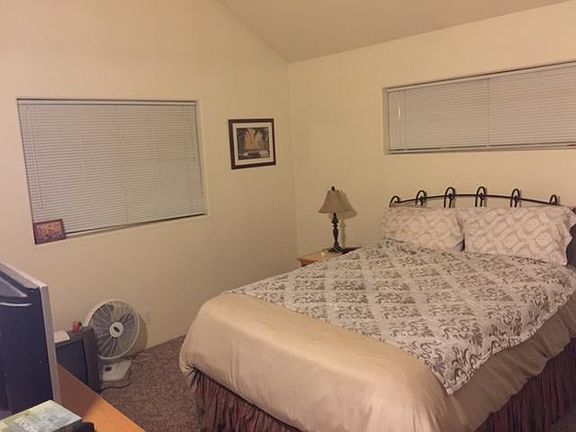 Upstairs master suite with walk-in closet and attached bath.