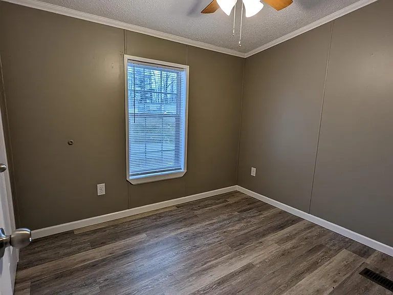 Bedroom 2 with ceiling fan, window and closet