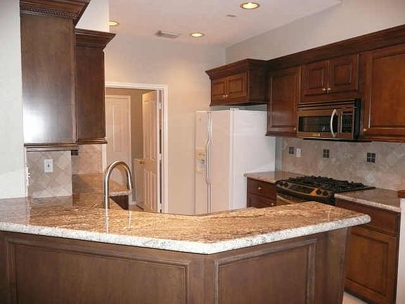 Updated kitchen! Granite counters, deep stainless sink, stai