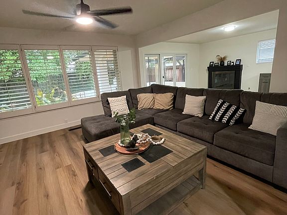 Living room with large windows into the private backyard