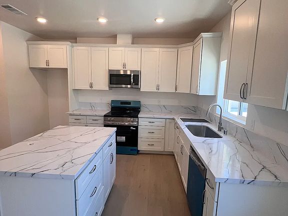 Good sized kitchen with new cabinets, counter tops, and stainless steel appliances. And an island for more work space!