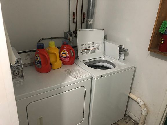 Shared washer and dryer, coin operated.