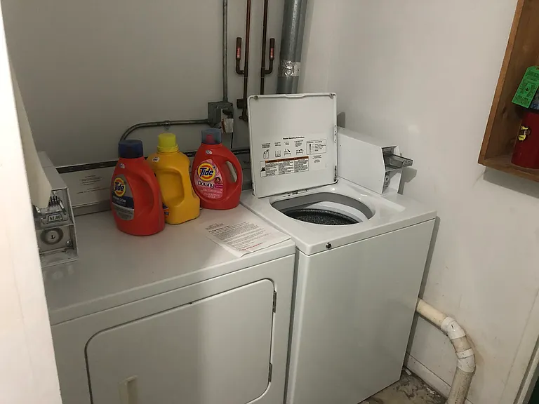 Shared washer and dryer, coin operated.
