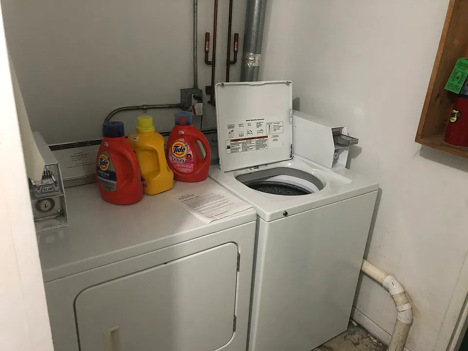 Shared washer and dryer, coin operated.