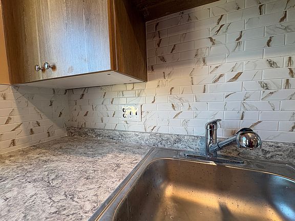 Kitchen- New windows, lighting & electrical, kitchen cabinets, walls & ceiling, kitchen counter, tiles and floor.