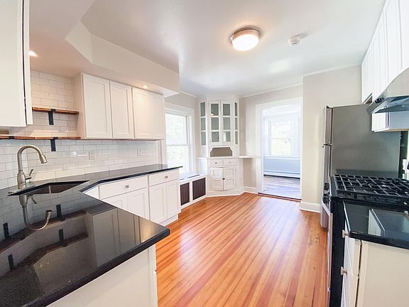 Mixing the old and new! An original built-in curio cabinet sits at the entrance to your extra space. Office? Dining room? You make it what you want!