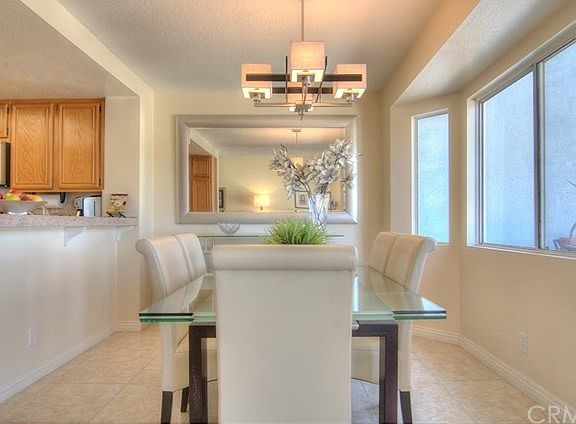 Separate dining area with lovely bay detail opens to kitchen and great room.