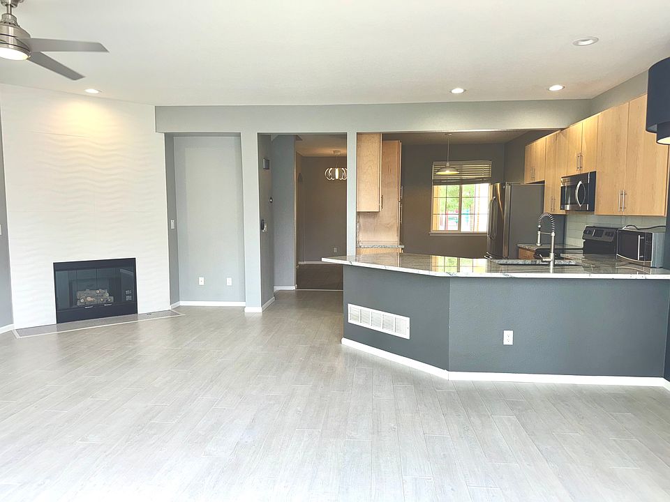 Great Room with Designer Tiled Fireplace Wall