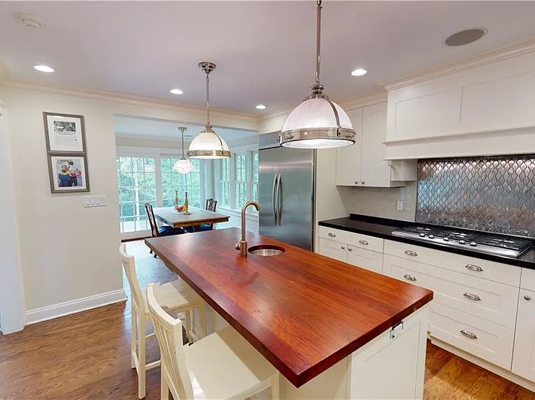 Modern hi-end chef's kitchen with stainless appliances and Bilotta custom kitchen cabinetry