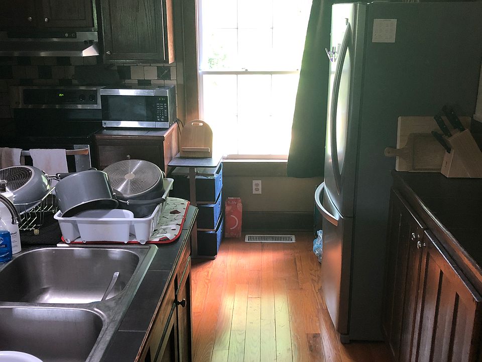 Large windows, spacious cabinets, stainless refrigerator and oven