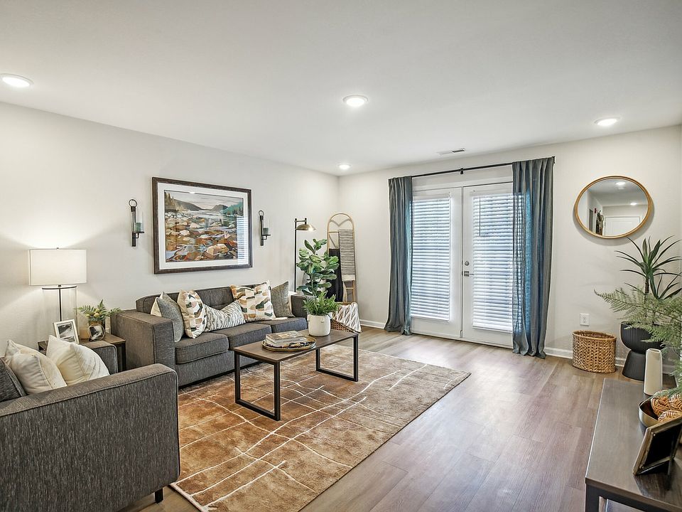 Create a relaxing atmosphere with a stylish living room and modern decor at The Preserve Murfreesboro apartments.