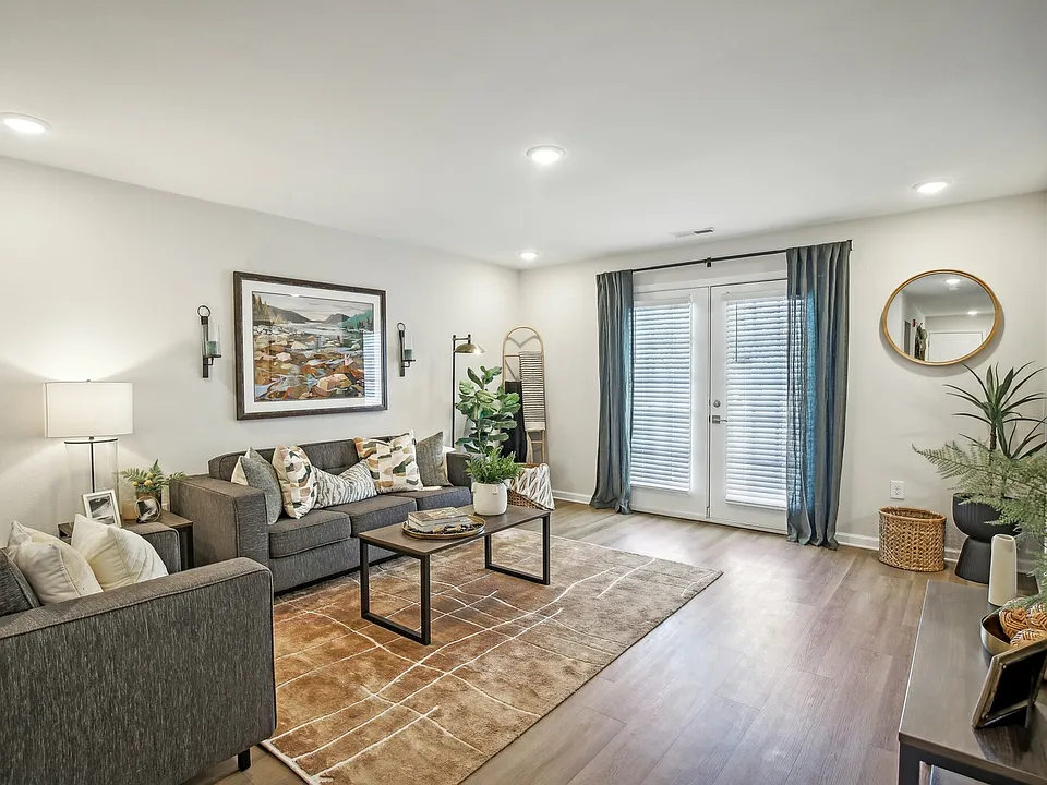 Create a relaxing atmosphere with a stylish living room and modern decor at The Preserve Murfreesboro apartments.