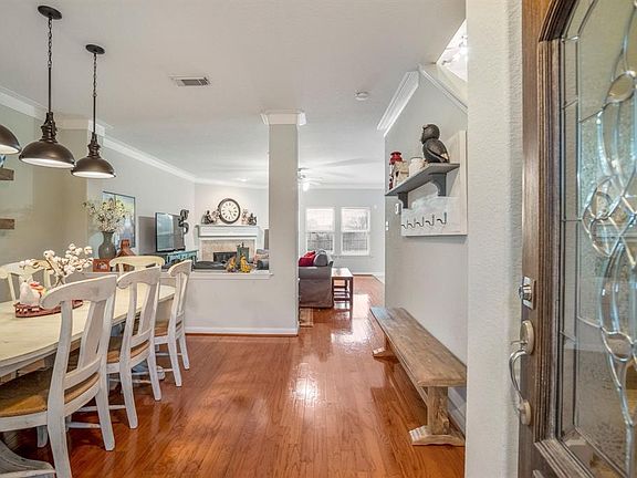 From the moment you enter the beautiful mahogany leaded glass door, you are greeted by an expanse of gorgeous wood floors, pendant lighting and neutral paint palette.