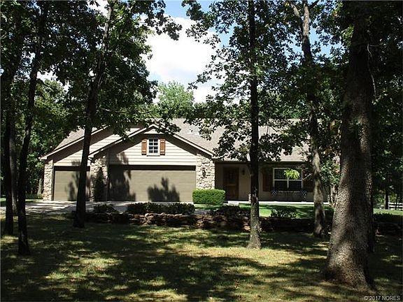 Beautiful almost one acre lot with lots of trees, two storage buildings in a gated addition