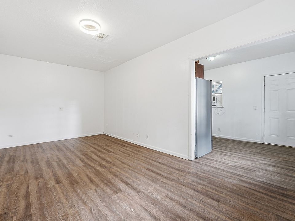 The lower level features a separate studio-style suite with its own full bathroom, kitchen, and private entrance ideal for a guest suite, home office, or bonus living space.