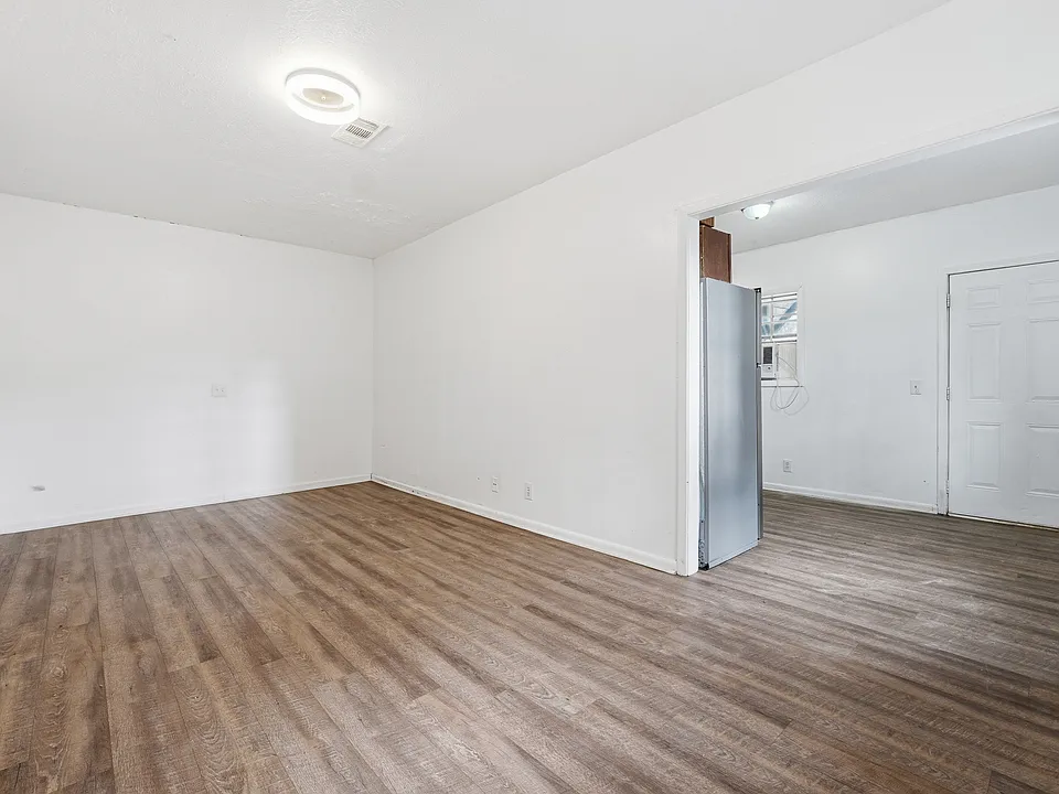 The lower level features a separate studio-style suite with its own full bathroom, kitchen, and private entrance ideal for a guest suite, home office, or bonus living space.