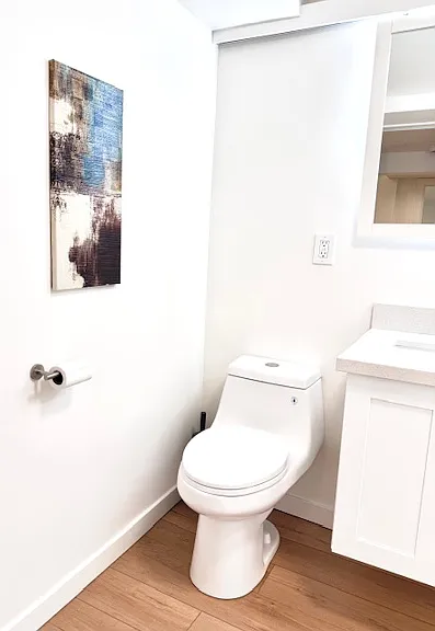 Brand new full bath with wall art.