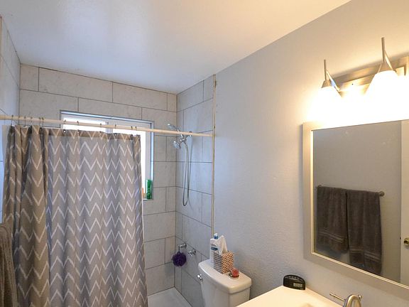 New Floor, Vanity, Lighting, and Tiled Shower upstairs (Curtain Replaced with Glass Door)