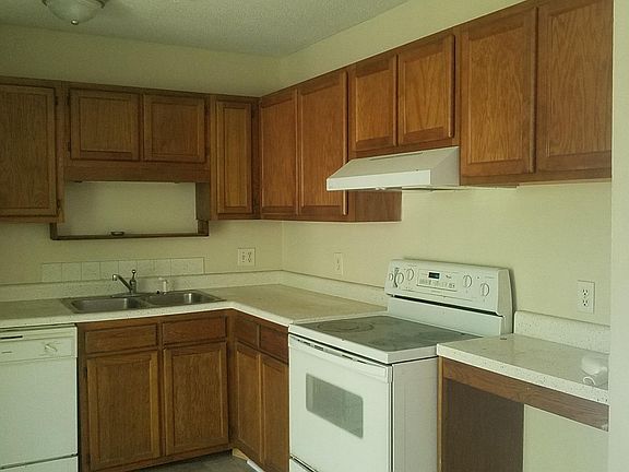 Eat-in kitchen has stove, refrigerator and dishwasher.  Laun