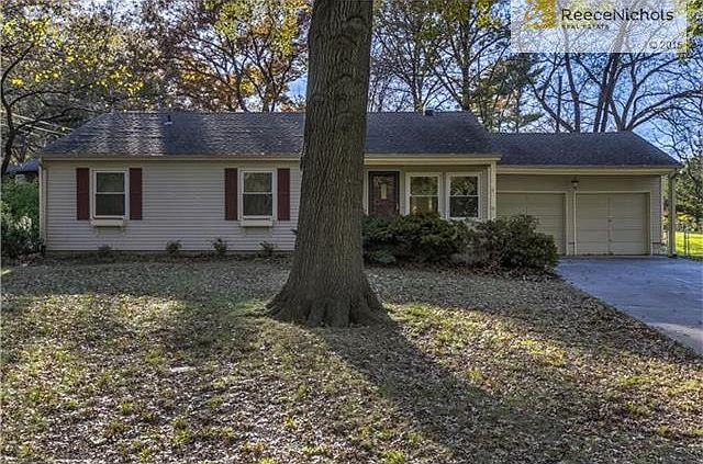 Fabulous Prairie Village location with hard to find 2 car garage