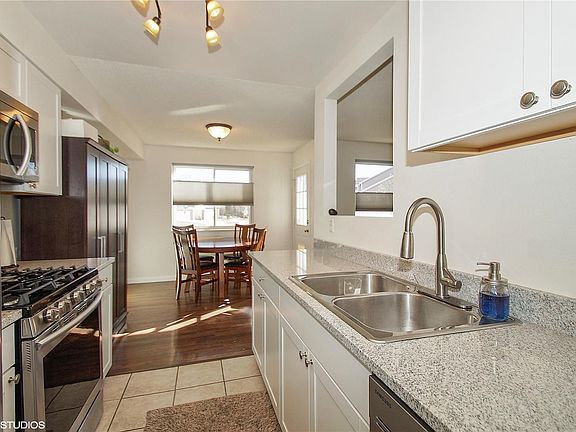 New cabinetry and lighting make for a light bright kitchen.